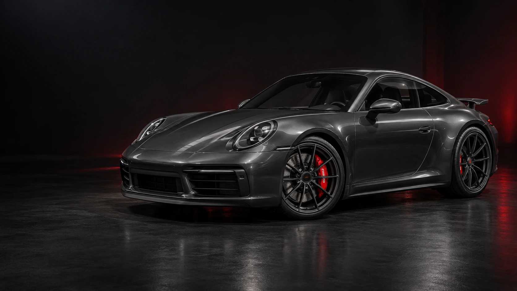 Graphite sports coupe with dark alloy wheels and red brake calipers with white decals